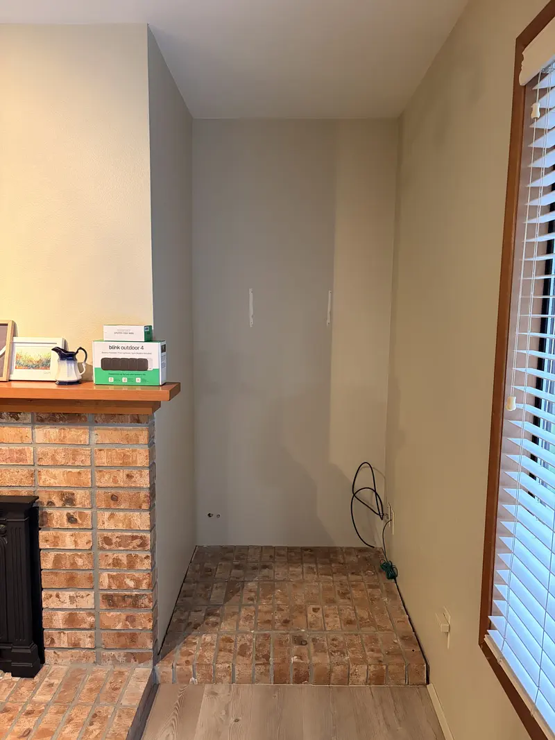 Alcove beside a brick fireplace before the work